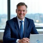 Professional accountant smiling in a modern office in Dublin