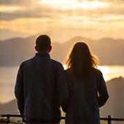 Happy couple enjoying a scenic view in Connemara, representing a tourism operator's success.
